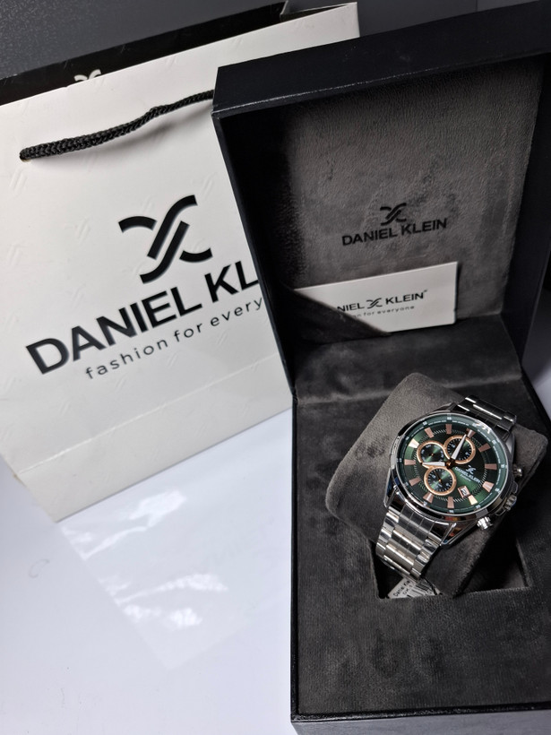 ساعت مردانه برند دنیل کلین با جعبه و پاکت دفترچه دنیل کلین