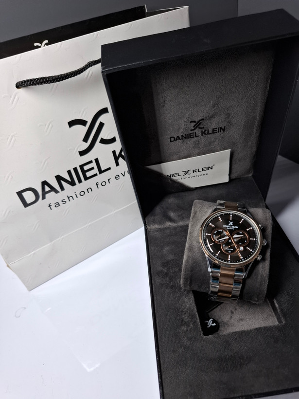 ساعت مردانه برند دنیل کلین با جعبه و پاکت دفترچه دنیل کلین