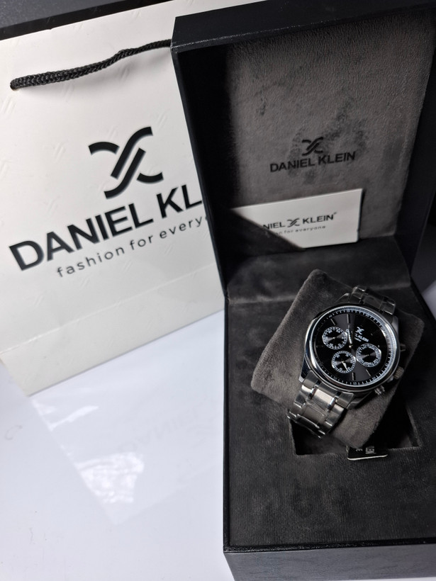 ساعت مردانه برند دنیل کلین با جعبه و پاکت دفترچه دنیل کلین