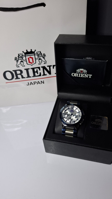 ساعت مردانه برند اورینت با جعبه و پاکت دفترچه اورینت