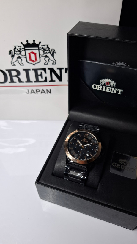 ساعت مردانه برند اورینت با جعبه و پاکت دفترچه اورینت