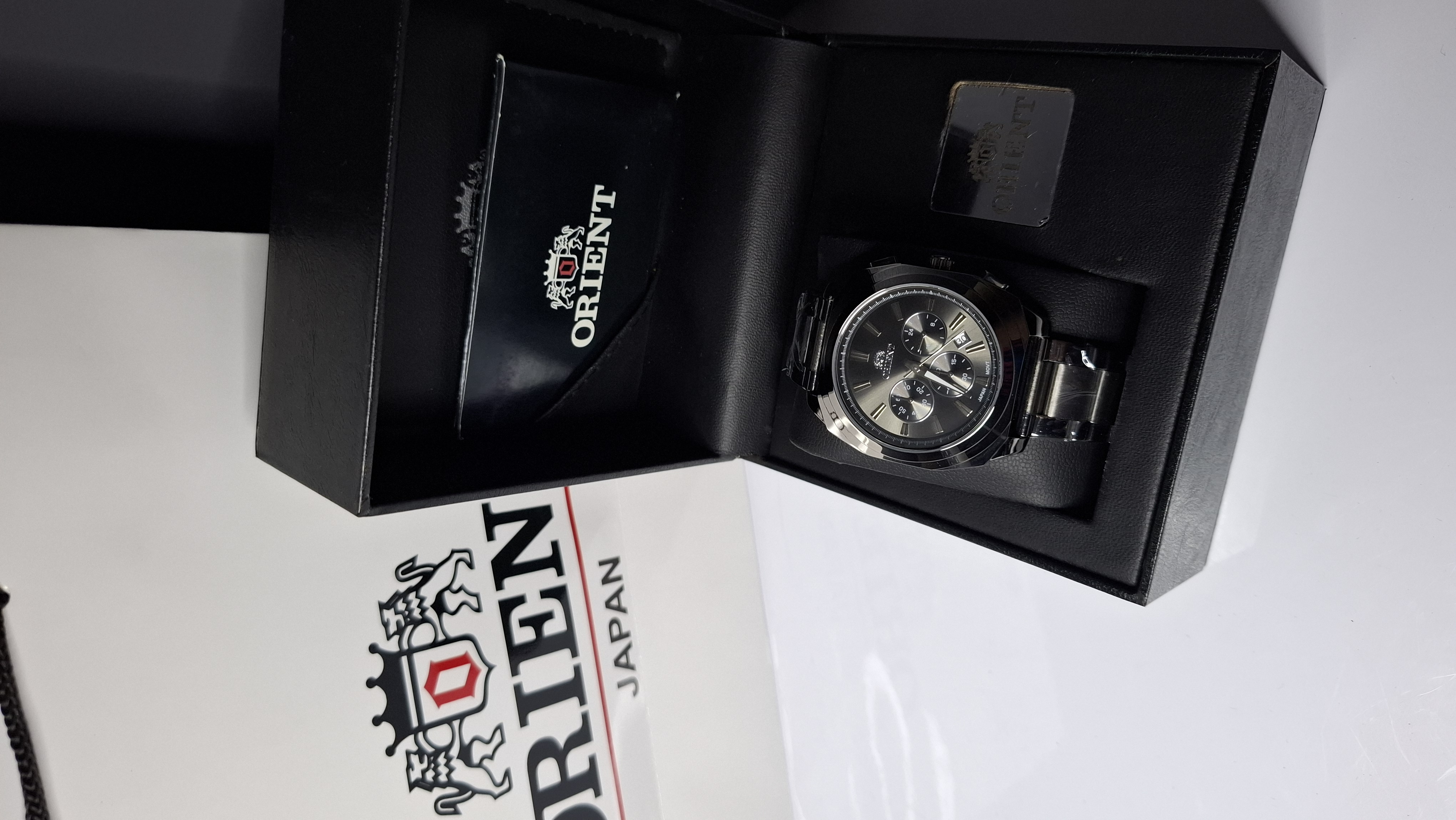 ساعت مردانه برند اورینت با جعبه و پاکت دفترچه اورینت