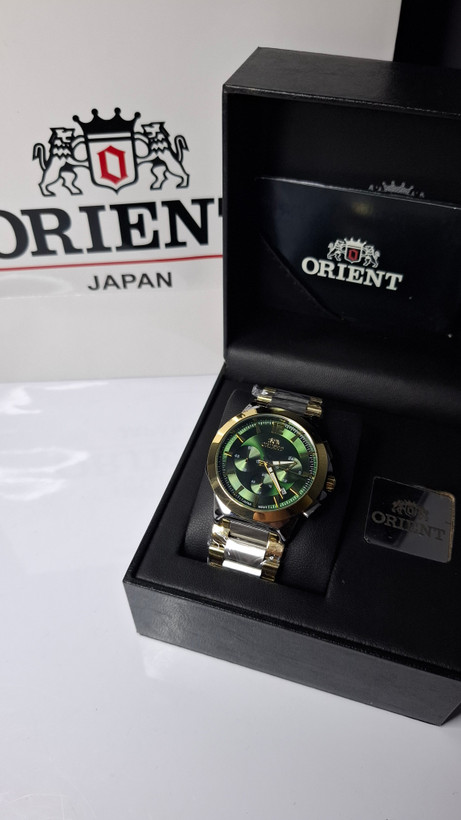 ساعت مردانه برند اورینت با جعبه و پاکت دفترچه اورینت