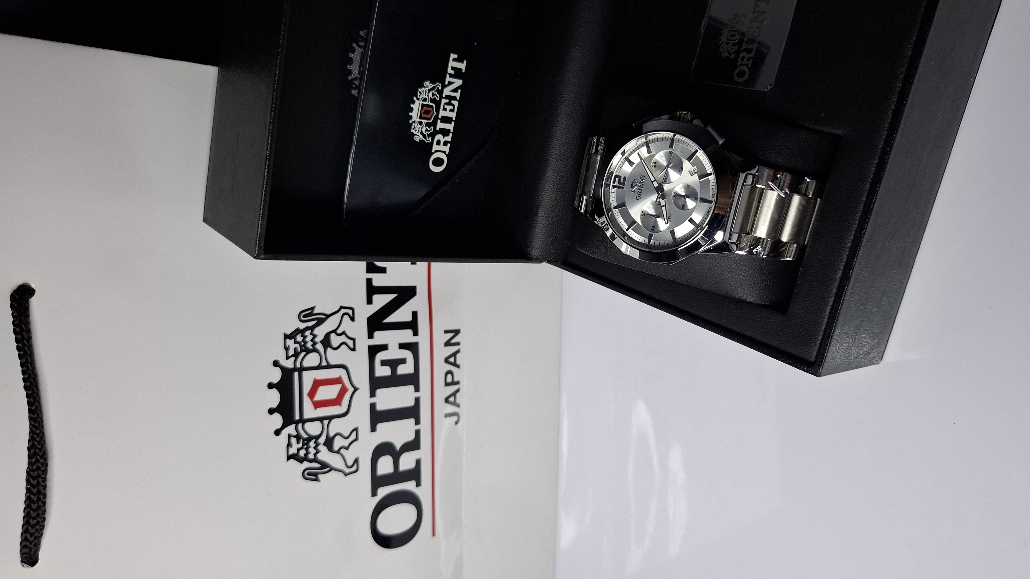 ساعت مردانه برند اورینت با جعبه و پاکت دفترچه اورینت