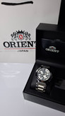 ساعت مردانه برند اورینت با جعبه و پاکت دفترچه اورینت