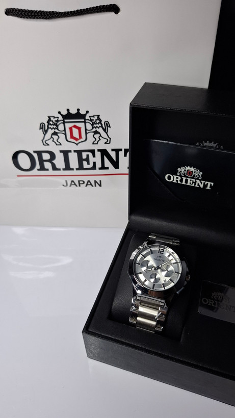 ساعت مردانه برند اورینت با جعبه و پاکت دفترچه اورینت
