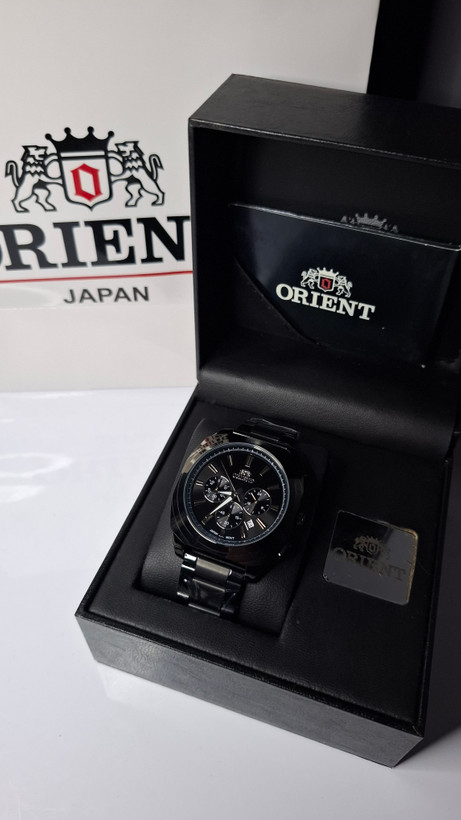 ساعت مردانه برند اورینت با جعبه و پاکت دفترچه اورینت