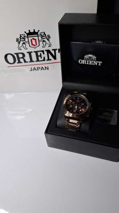 ساعت مردانه برند اورینت با جعبه و پاکت دفترچه اورینت