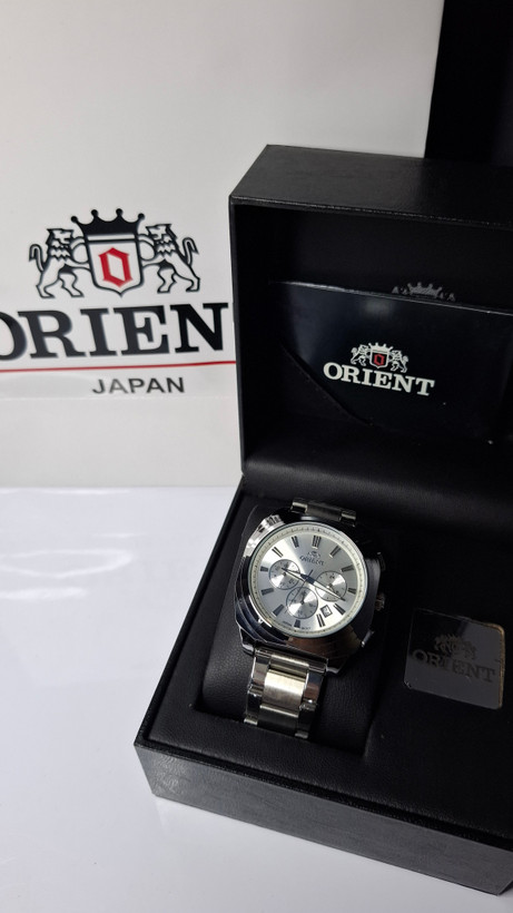 ساعت مردانه برند اورینت با جعبه و پاکت دفترچه اورینت